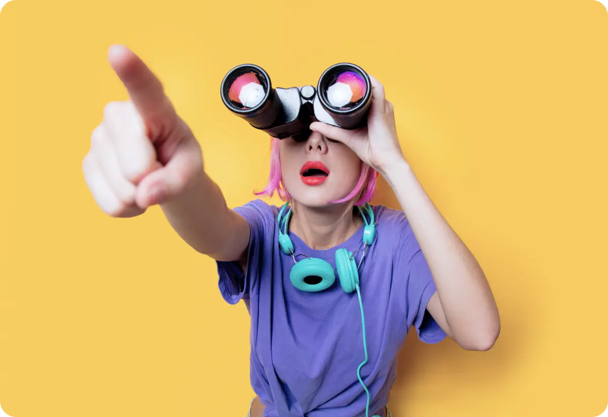 Surprised individual with colorful hair using binoculars to search.